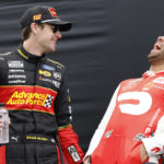 
              Ryan Blaney, left, and Bubba Wallace share a laugh during driver introductions before a NASCAR Cup Series auto race at Daytona International Speedway, Sunday, Aug. 28, 2022, in Daytona Beach, Fla. (AP Photo/Terry Renna)
            