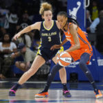 
              Connecticut Sun forward DeWanna Bonner (24) dribbles against Dallas Wings guard Marina Mabrey (3) in the first quarter during Game 3 of a WNBA first-round playoff series basketball game in Arlington, Texas, Wednesday, Aug. 24, 2022. (AP Photo/LM Otero)
            