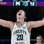 
              New York Liberty guard Sabrina Ionescu reacts after the Liberty defeated the Chicago Sky 98-91 in Game 1 of a WNBA basketball first-round playoff series Wednesday, Aug. 17, 2022, in Chicago. (AP Photo/Nam Y. Huh)
            