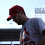 
              St. Louis Cardinals starting pitcher Adam Wainwright enters the dugout after pitching in the fifth inning of a baseball game against the Chicago Cubs Tuesday, Aug. 23, 2022, in Chicago. (AP Photo/Charles Rex Arbogast)
            