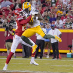 
              Green Bay Packers wide receiver Amari Rodgers catches a pass as Kansas City Chiefs cornerback Joshua Williams, left, defends during the first half of an NFL preseason football game Thursday, Aug. 25, 2022, in Kansas City, Mo. (AP Photo/Ed Zurga)
            