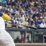 
              Milwaukee Brewers' Christian Yelich hits a three-run home run during the seventh inning of a baseball game against the Chicago Cubs Saturday, Aug. 27, 2022, in Milwaukee. (AP Photo/Morry Gash)
            