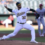 
              Oakland Athletics starting pitcher James Kaprielian (32) throws to a Los Angeles Angels batter during the first inning of a baseball game in Oakland, Calif., Tuesday, Aug.p 9, 2022. (AP Photo/Jed Jacobsohn)
            