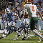 
              North Carolina's Cam'Ron Kelly (9), Dontae Balfour (14) and Cedric Gray (33) go for a fumble in front of Florida A&M's Darian Oxendine (83), Jeremy Moussa (8) and Jalen Goss (61) during the second half of an NCAA college football game in Chapel Hill, N.C., Saturday, Aug. 27, 2022. North Carolina recovered the fumble and scored on the next play. (AP Photo/Chris Seward)
            