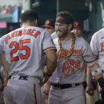 
              Baltimore Orioles' Anthony Santander (25) and Ryan McKenna, right, celebrate affer McKenna hit a solo home run in the second inning of a baseball game against the Texas Rangers, Wednesday, Aug. 3, 2022, in Arlington, Texas. (AP Photo/Tony Gutierrez)
            