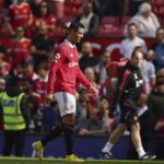 
              Manchester United's Cristiano Ronaldo walks on the field at the end of the English Premier League soccer match between Manchester United and Brighton at Old Trafford stadium in Manchester, England, Sunday, Aug. 7, 2022. Brighton won 2-1. (AP Photo/Dave Thompson)
            