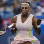 
              Serena Williams, of the United States, reacts after Emma Raducanu, of Britain, won a point during the Western & Southern Open tennis tournament Tuesday, Aug. 16, 2022, in Mason, Ohio. (AP Photo/Jeff Dean)
            