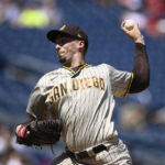 
              San Diego Padres starting pitcher Blake Snell throws during the second inning of a baseball game against the Washington Nationals, Sunday, Aug. 14, 2022, in Washington. (AP Photo/Nick Wass)
            