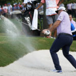 
              Sepp Straka, of Austria, hits out of a bunker on the 11th green during a playoff in the final round of the St. Jude Championship golf tournament, Sunday, Aug. 14, 2022, in Memphis, Tenn. (AP Photo/Mark Humphrey)
            