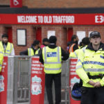 
              Police officers stand guard before the English Premier League soccer match against Liverpool at Old Trafford stadium in Manchester, England, Monday, Aug 22, 2022. (AP Photo/Dave Dave Thompson)
            