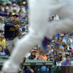 
              Milwaukee Brewers third baseman Luis Urias throws out Chicago Cubs' Willson Contreras at first base during the first inning of a baseball game in Chicago, Saturday, Aug. 20, 2022. (AP Photo/Nam Y. Huh)
            