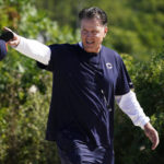 
              Chicago Bears head coach Matt Eberflus greets fans as he walks to the NFL football team's training camp, Saturday, July 30, 2022, in Lake Forest, Ill. (AP Photo/Nam Y. Huh)
            