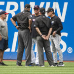 
              Unidentified members of the Cleveland Guardians grounds crew, left, meet with umpire David Rackley, third from left, and umpire Chad Fairchild, second from right, and Guardians manager Terry Francona, third from right, and Chicago White Sox manager Tony LaRussa, right, to discuss the Progressive Field conditions before a baseball game in Cleveland, Sunday, Aug. 21, 2022. (AP Photo/Phil Long)
            