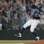 
              Seattle Mariners' Luis Torrens reacts after he hit a walk-off RBI single to give the Mariners a 1-0 win over the New York Yankees in a 13-inning baseball game, Tuesday, Aug. 9, 2022, in Seattle. (AP Photo/Ted S. Warren)
            