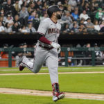 
              Arizona Diamondbacks' Emmanuel Rivera rounds the bases after hitting a two-run home run during the second inning of a baseball game against the Chicago White Sox in Chicago, Friday, Aug. 26, 2022. (AP Photo/Nam Y. Huh)
            