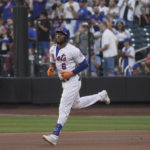 
              New York Mets' Starling Marte runs the bases after his first-inning home run during a baseball game against the Cincinnati Reds, Monday, Aug. 8, 2022, in New York. (AP Photo/Bebeto Matthews)
            
