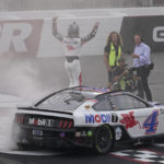 
              Kevin Harvick, top left, celebrates after winning a NASCAR Cup Series auto race at Richmond Raceway, Sunday, Aug. 14, 2022, in Richmond, Va. (AP Photo/Steve Helber)
            