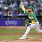 
              Oakland Athletics' Adam Oller pitches against the New York Yankees during the fifth inning of a baseball game in Oakland, Calif., Saturday, Aug. 27, 2022. (AP Photo/Godofredo A. Vásquez)
            