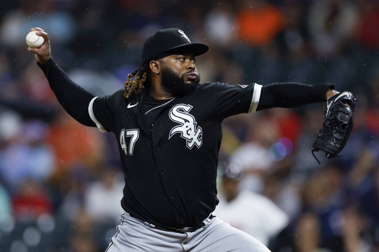Chicago White Sox starting pitcher Johnny Cueto delivers against the Cleveland Guardians during the...