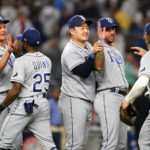 
              Tampa Bay Rays' Yu Chang, left, of Taiwan, Ji-Man Choi, of South Korea, Center and David Peralta second from right, celebrate with teammates Roman Quinn and Taylor Walls, right, after a baseball game against the New York Yankees Tuesday, Aug. 16, 2022, in New York. The Rays won 3-1. (AP Photo/Frank Franklin II)
            