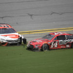 
              Chase Briscoe (14) and Bubba Wallace (23) slide along the front stretch after getting involved in a multi-car wreck during a NASCAR Cup Series auto race at Daytona International Speedway, Sunday, Aug. 28, 2022, in Daytona Beach, Fla. (AP Photo/Phelan M. Ebenhack)
            