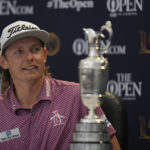 
              FILE - Cameron Smith, of Australia, with the claret jug trophy, speaks during a press conference after winning the British Open golf championship on the Old Course at St. Andrews, Scotland, Sunday July 17, 2022. Fresh off a major, he already was being asked about joining LIV Golf. Smith officially joined the Saudi-funded league on Tuesday, Aug. 30. (AP Photo/Alastair Grant, File)
            
