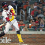 
              Atlanta Braves William Contreras hits a single in the fourth inning of a baseball game against the Houston Astros Saturday, Aug. 20, 2022, in Atlanta. (AP Photo/Hakim Wright Sr.)
            