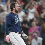 
              Seattle Mariners' Luis Torrens reacts after he hit a walk-off RBI single to give the Mariners a 1-0 win over the New York Yankees in a 13-inning baseball game, Tuesday, Aug. 9, 2022, in Seattle. (AP Photo/Ted S. Warren)
            