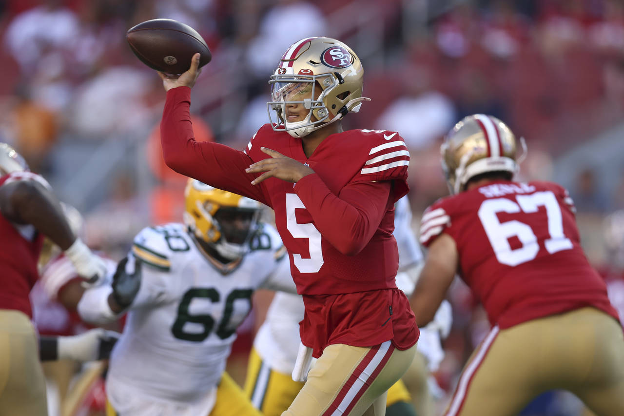 San Francisco 49ers quarterback Trey Lance (5) passes against the Green Bay Packers during the firs...