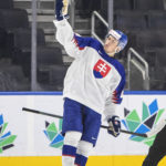 
              Slovakia's Matej Kaslik (11) celebrates after his shootout goal against Latvia during an IIHF junior world hockey championships game Friday, Aug. 12, 2022, in Edmonton, Alberta. (Jason Franson/The Canadian Press via AP)
            