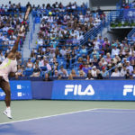 
              Serena Williams, of the United States, serves to Emma Raducanu, of Britain, during the Western & Southern Open tennis tournament Tuesday, Aug. 16, 2022, in Mason, Ohio. (AP Photo/Jeff Dean)
            