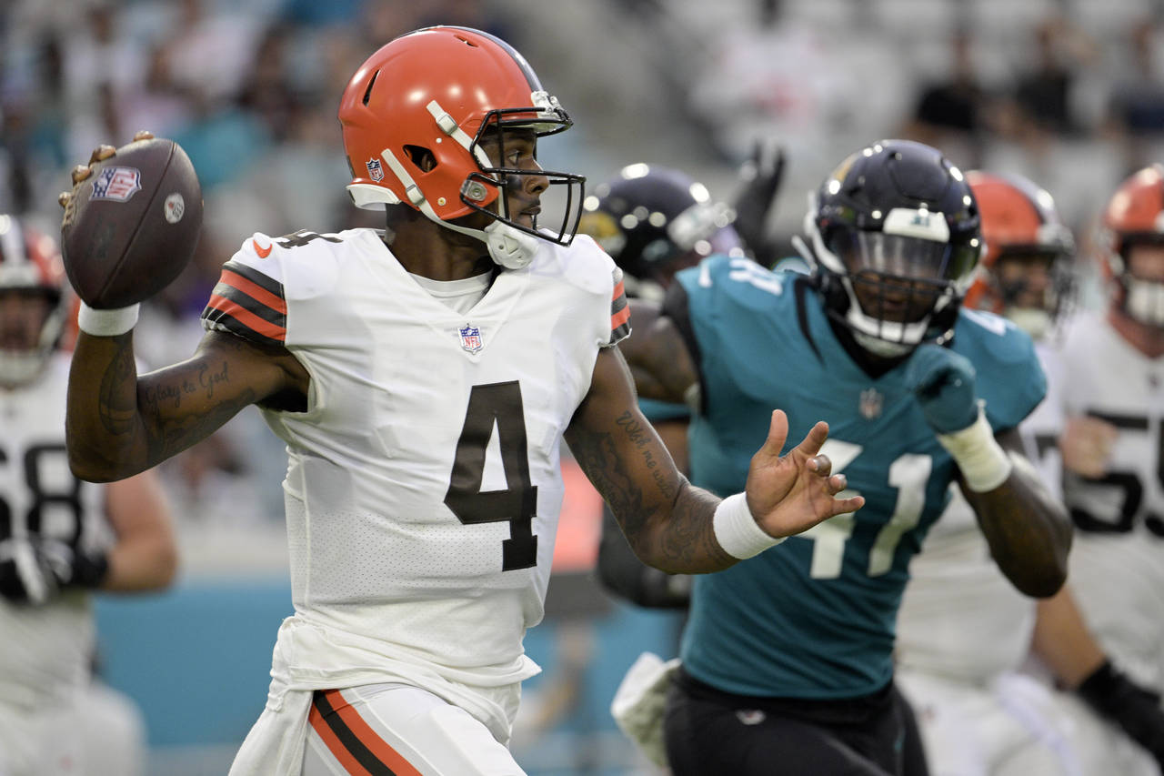 Cleveland Browns quarterback Deshaun Watson (4) looks for a receiver as he is pressured by Jacksonv...