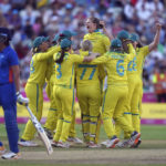
              Australia players celebrate winning the gold medal in the cricket final after defeating India at Edgbaston Stadium on day ten of 2022 Commonwealth Games in Birmingham, England, Sunday Aug. 7, 2022. (Adam Davy/PA via AP)
            