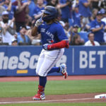 
              Toronto Blue Jays' Vladimir Guerrero Jr. runs the bases after hitting a two-run home run against the Baltimore Orioles during the first inning of a baseball game Tuesday, Aug. 16, 2022, in Toronto. (Jon Blacker/The Canadian Press via AP)
            