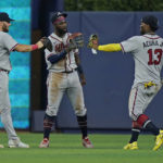
              Atlanta Braves left fielder Robbie Grossman (15) center fielder Michael Harris II (23) and right fielder Ronald Acuna Jr. (13) celebrate after the Braves beat the Miami Marlins 5-2 during the first game of a baseball doubleheader, Saturday, Aug. 13, 2022, in Miami. (AP Photo/Wilfredo Lee)
            