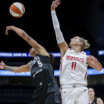 
              Seattle Storm forward Gabby Williams (5) tips the ball away from Washington Mystics forward Elena Delle Donne (11) during the first half of Game 1 of a WNBA basketball first-round playoff series Thursday, Aug. 18, 2022, in Seattle. (AP Photo/Lindsey Wasson)
            