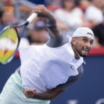 
              Nick Kyrgios of Australia serves to Daniil Medvedev during second round play at the National Bank Open tennis tournament Wednesday Aug. 10, 2022. in Montreal. (Paul Chiasson/The Canadian Press via AP)
            