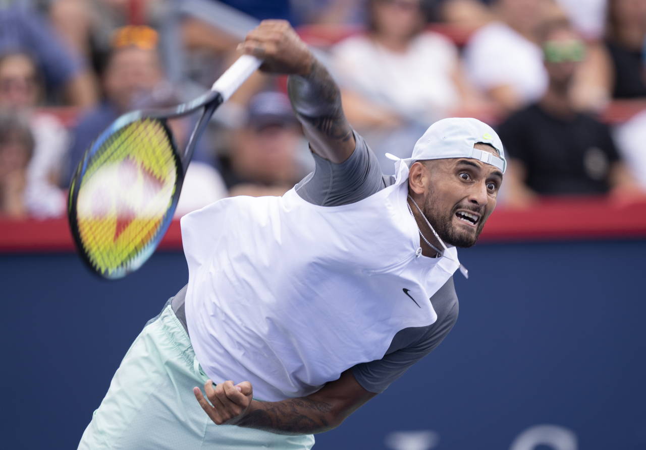 Nick Kyrgios of Australia serves to Daniil Medvedev during second round play at the National Bank O...