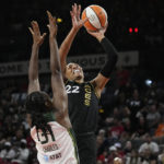 
              Las Vegas Aces forward A'ja Wilson (22) shoots over Seattle Storm's Tina Charles during the first half in Game 1 of a WNBA basketball semifinal playoff series Sunday, Aug. 28, 2022, in Las Vegas. (AP Photo/John Locher)
            