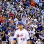 
              Fans cheer on New York Mets' starting pitcher Jacob deGrom during the fourth inning of a baseball game against the Atlanta Braves, Sunday, Aug. 7, 2022, in New York. (AP Photo/Julia Nikhinson)
            