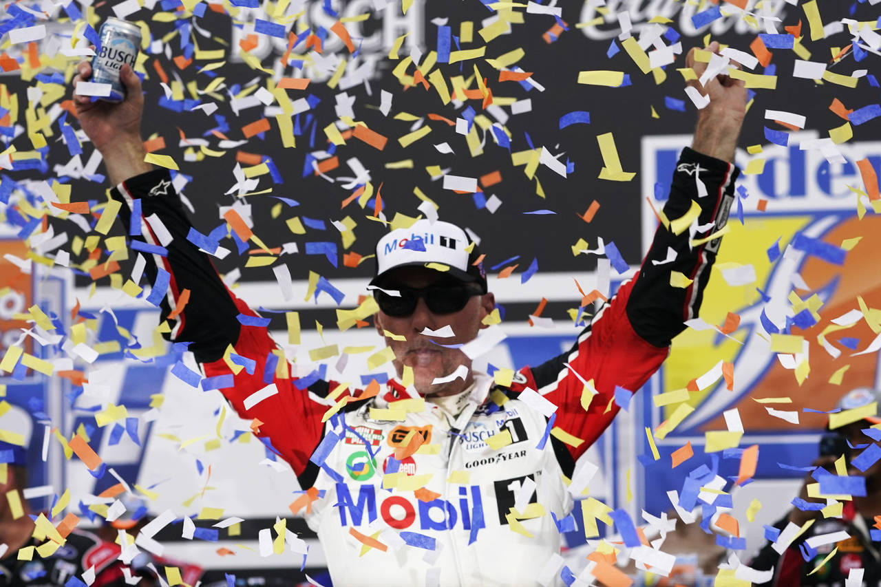 Kevin Harvick celebrates after winning a NASCAR Cup Series auto race at Richmond Raceway, Sunday, A...