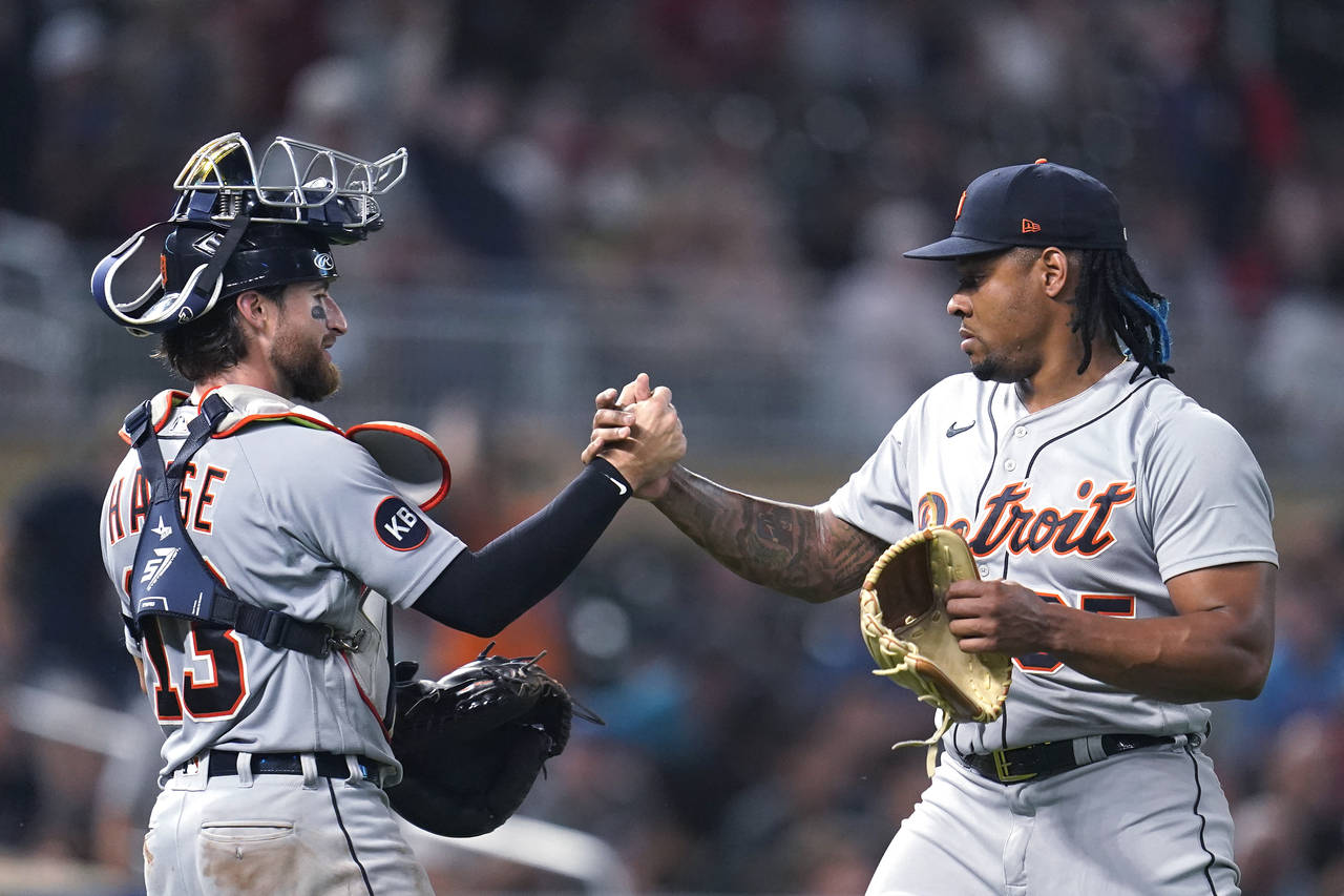 Detroit Tigers catcher Eric Haase, left, and relief pitcher Gregory Soto clasp hands following the ...