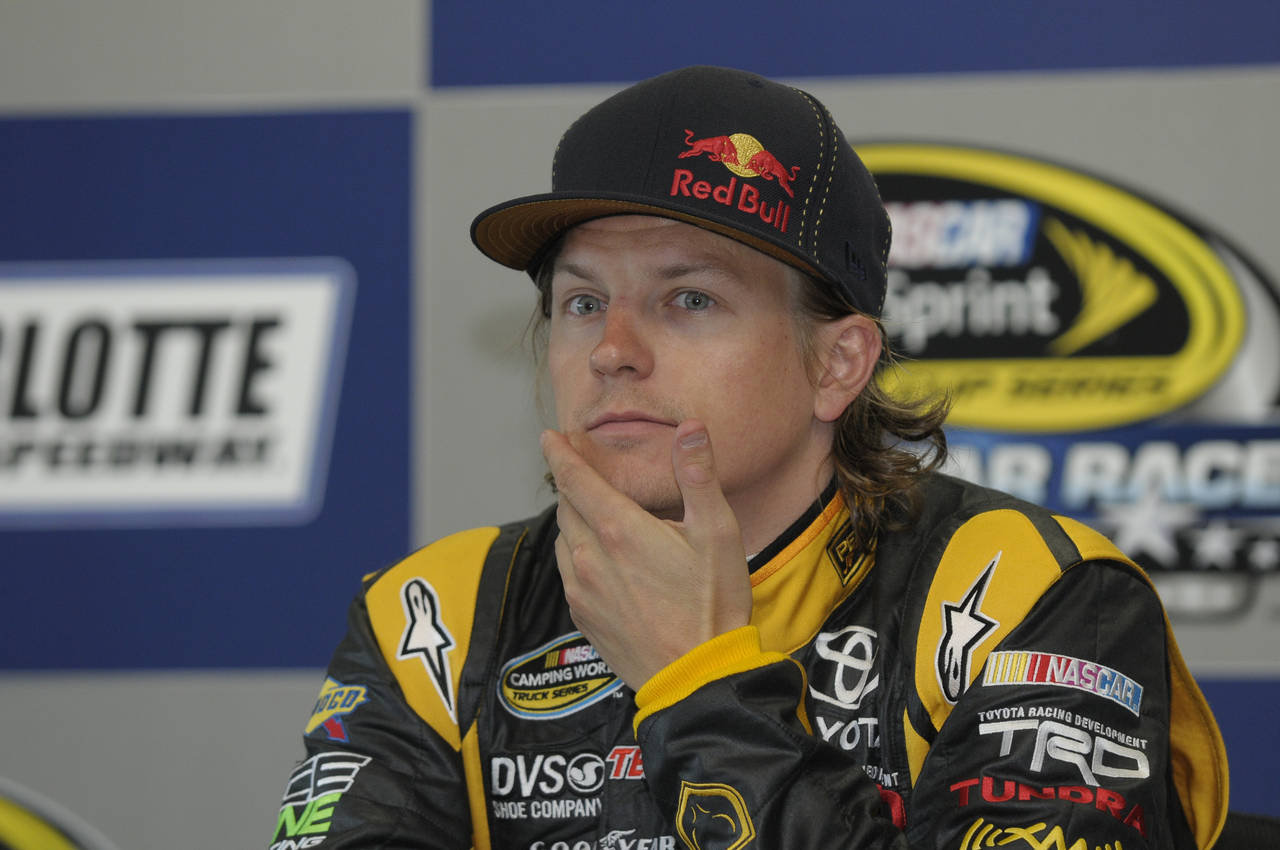 FILE - Kimi Raikkonen, of Finland, pauses during a news conference in Concord, N.C., May 20, 2011. ...