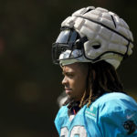 
              Carolina Panthers' Darryl Johnsonarrives for the NFL football team's training camp carrying his helmet with a protective covering at Wofford College on Wednesday, Aug. 3, 2022, in Spartanburg, S.C. The NFL has made the use of Guardian Caps mandatory up until the second week of the preseason for offensive and defensive lineman, linebackers and tight ends. (AP Photo/Chris Carlson)
            