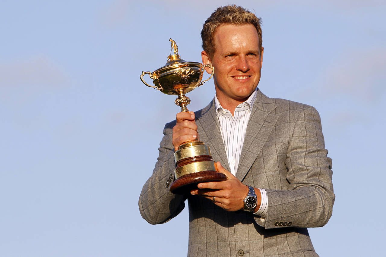 FILE - Europe's Luke Donald holds the Ryder Cup after Europe defeated the United States on the fina...