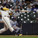 
              Milwaukee Brewers' Victor Caratini hits a game-ending, two-run single during the 11th inning of the team's baseball game against the Los Angeles Dodgers on Tuesday, Aug. 16, 2022, in Milwaukee. The Brewers won 5-4. (AP Photo/Aaron Gash)
            