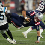 
              Carolina Panthers cornerback Kalon Barnes (35) brings down New England Patriots quarterback Bailey Zappe during the second half of a preseason NFL football game, Friday, Aug. 19, 2022, in Foxborough, Mass. (AP Photo/Charles Krupa)
            