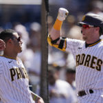 
              San Diego Padres' Jake Cronenworth, right, celebrates with teammate Manny Machado after hitting a two-run home run during the sixth inning of the first baseball game of a doubleheader against the Colorado Rockies, Tuesday, Aug. 2, 2022, in San Diego. (AP Photo/Gregory Bull)
            
