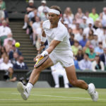 
              FILE - Spain's Rafael Nadal returns to Taylor Fritz of the US in a men's singles quarterfinal match on day ten of the Wimbledon tennis championships in London, Wednesday, July 6, 2022. Rafael Nadal has withdrawn from the upcoming hard-court tournament in Montreal because of the abdominal injury that caused him to pull out of Wimbledon ahead of the semifinals. The Spaniard had been 19-0 in Grand Slam matches this year when he decided the injury was too much at Wimbledon. (AP Photo/Kirsty Wigglesworth, File)
            