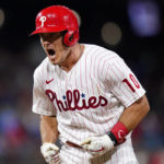 
              Philadelphia Phillies' J.T. Realmuto reacts after hitting a run-scoring single against Miami Marlins pitcher Sandy Alcantara during the eighth inning of a baseball game, Wednesday, Aug. 10, 2022, in Philadelphia. (AP Photo/Matt Slocum)
            